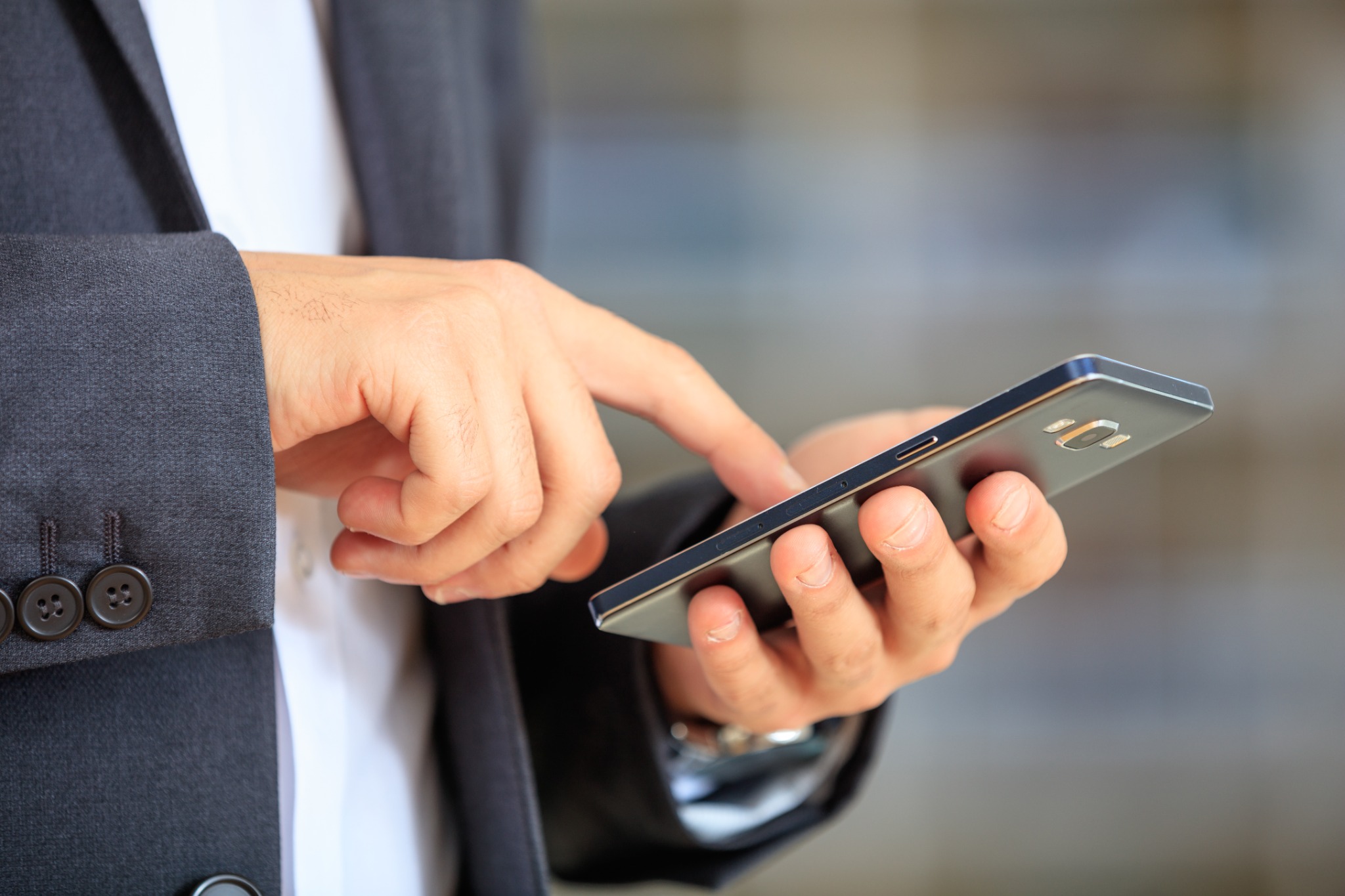 Businessperson using a smartphone